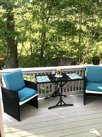 270 Sunderland Road, Unit 95 Worcester, MA 01604 - Photo 2 of 17 a view of a chairs and table in the roof deck