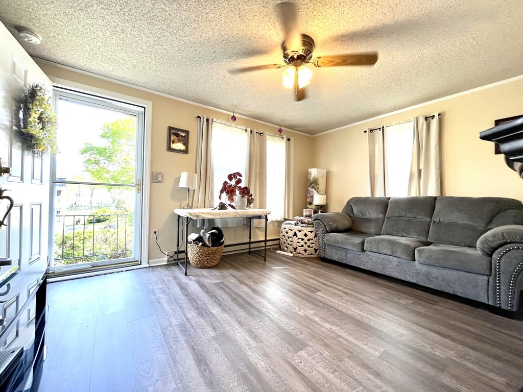 270 Sunderland Road, Unit 95 Worcester, MA 01604 - Photo 6 of 17 a living room with furniture and a large window