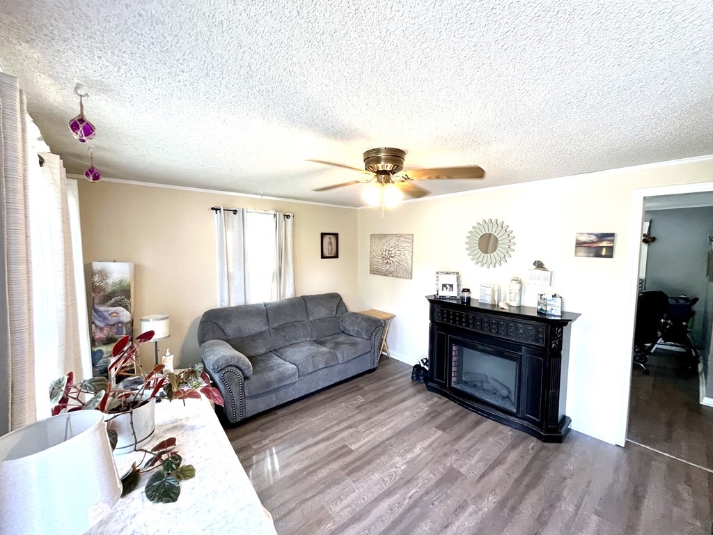 270 Sunderland Road, Unit 95 Worcester, MA 01604 - Photo 7 of 17 a living room with furniture and a fireplace