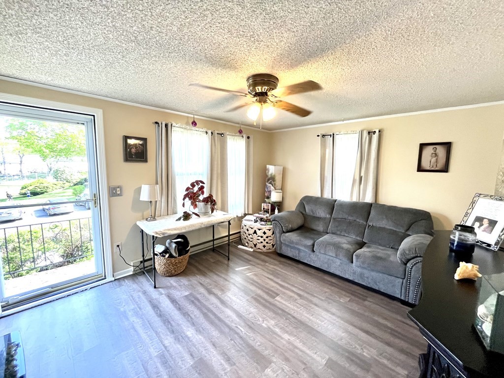 270 Sunderland Road, Unit 95 Worcester, MA 01604 - Photo 8 of 17 a living room with furniture and a large window