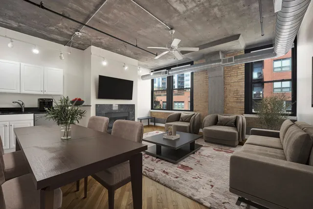 a view of a livingroom with furniture and a flat screen tv