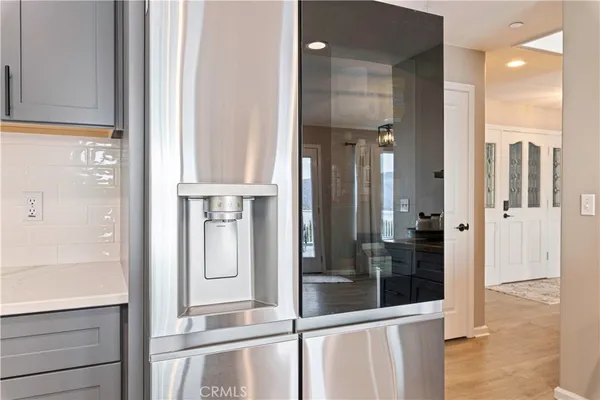 a kitchen with a counter space cabinets and stainless steel appliances