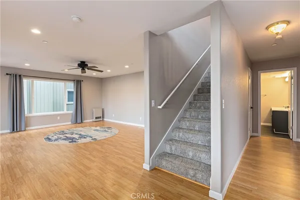 an empty room with windows and entrance