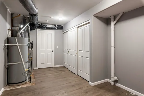 a view of a hall with wooden floor
