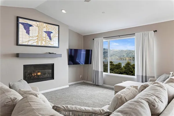 a view of a room with furniture and a window