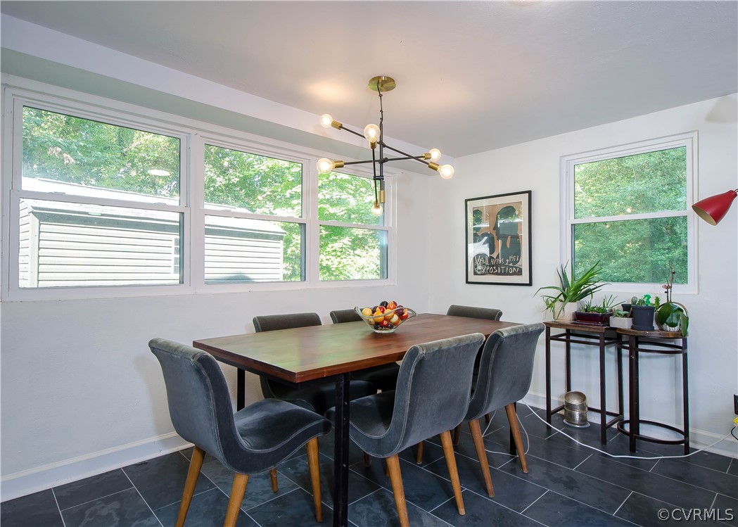 7638 Redbud Road Richmond, VA 23235 - Photo 11 of 32 The dining area has slate tile, and a modern hangi