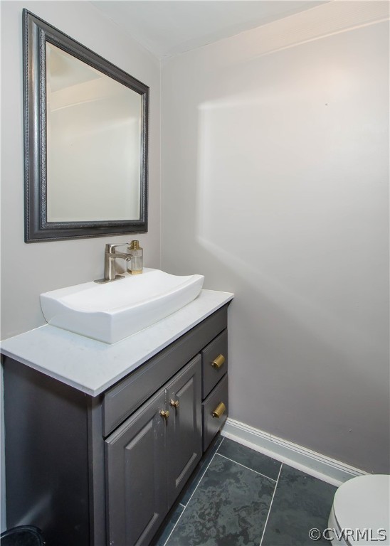 7638 Redbud Road Richmond, VA 23235 - Photo 15 of 32 The hall bathroom has a newer vanity, sink, and fi