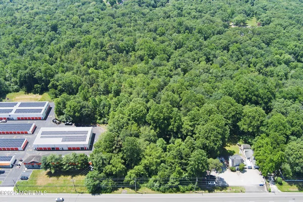 an aerial view of a house with yard