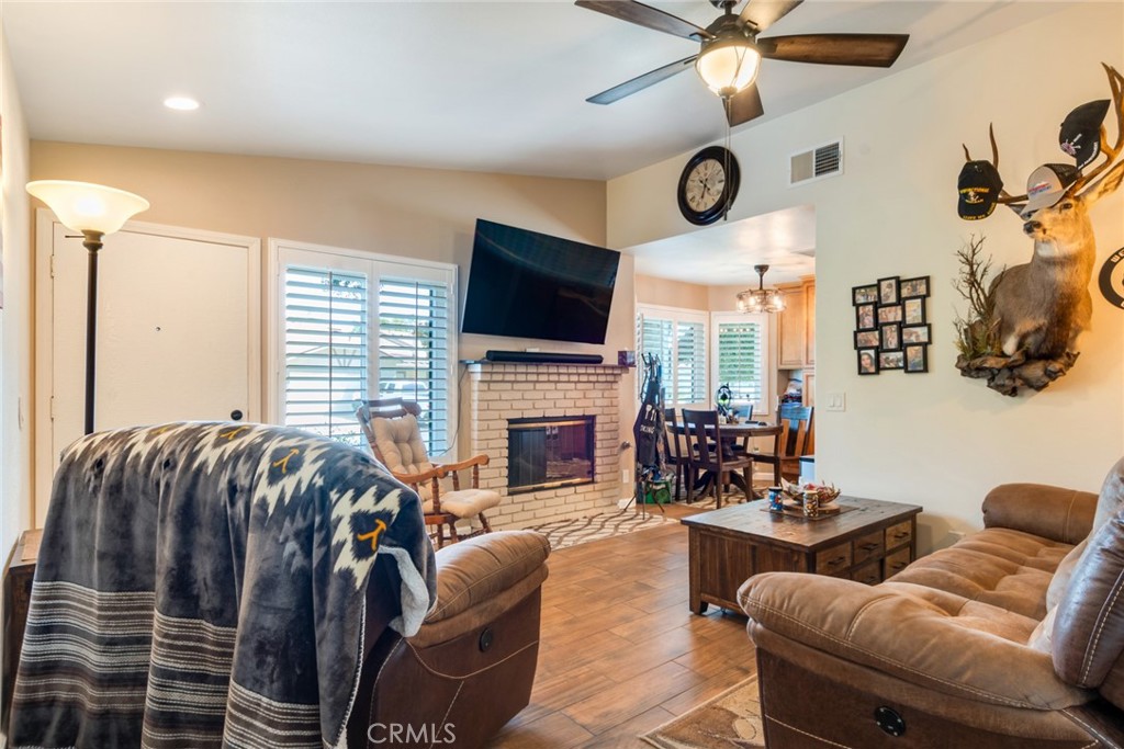3198 Bexfield Court Riverside, CA 92503 - Photo 4 of 24 Living Room with Wood-Look Porcelain Tile and Gas Fireplace
