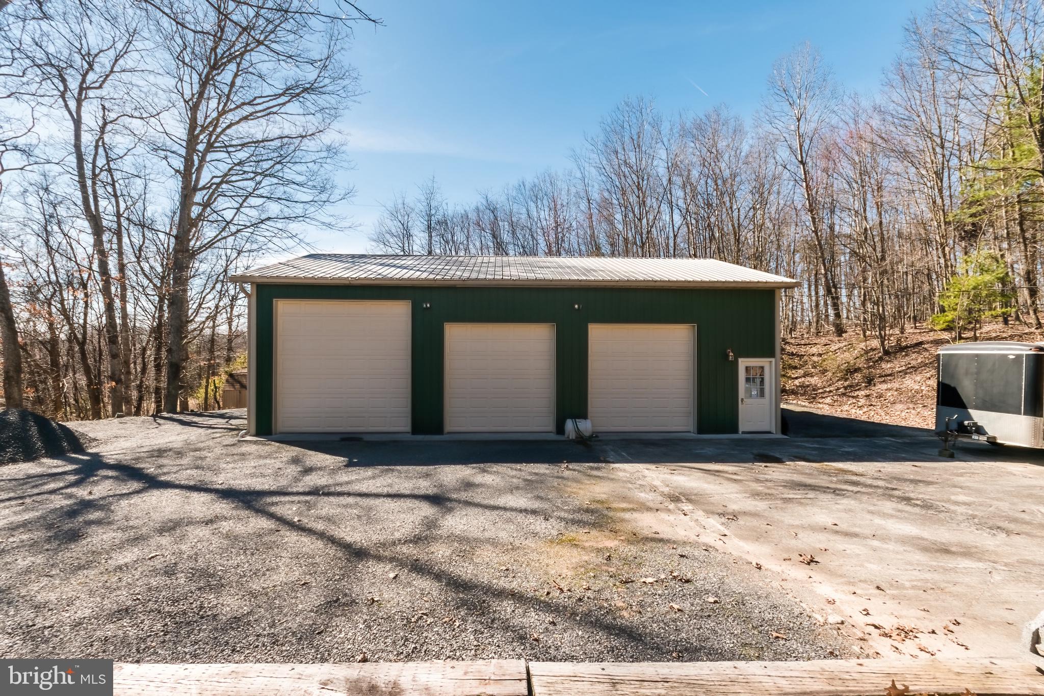 976 Hunting Ridge Road Winchester, VA 22603 - Photo 34 of 120 32 foot RV parking inside the 12 x 12 garage door