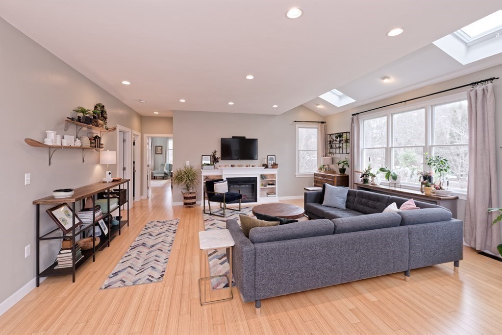 12 Cider Mill Road Stow, MA 01775 - Photo 12 of 42 a living room with furniture fireplace and flat screen tv