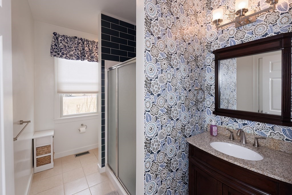 12 Cider Mill Road Stow, MA 01775 - Photo 13 of 42 a bathroom with a sink and a mirror
