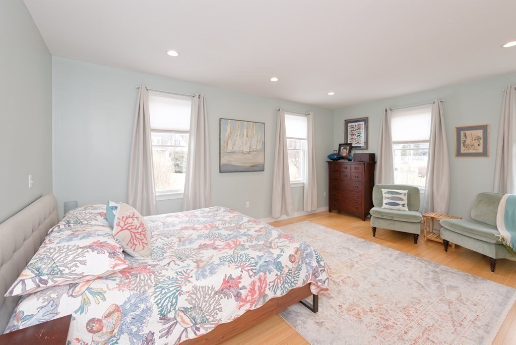 12 Cider Mill Road Stow, MA 01775 - Photo 14 of 42 a bedroom with a bed and wooden floor