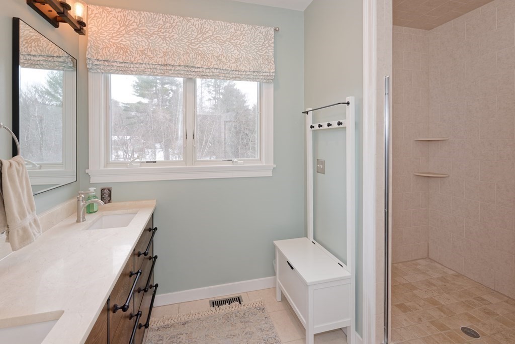 12 Cider Mill Road Stow, MA 01775 - Photo 16 of 42 a bathroom with a sink a toilet and window