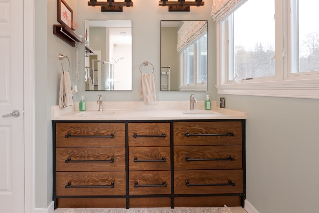 12 Cider Mill Road Stow, MA 01775 - Photo 17 of 42 a bathroom with a double vanity sink and a mirror