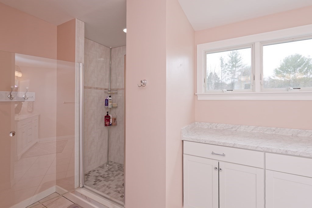 12 Cider Mill Road Stow, MA 01775 - Photo 31 of 42 a bathroom with a granite countertop sink and shower
