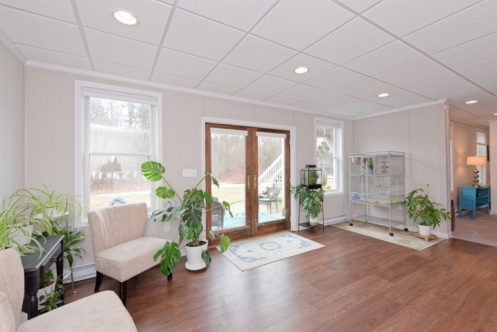 12 Cider Mill Road Stow, MA 01775 - Photo 32 of 42 a living room with furniture windows and wooden floor