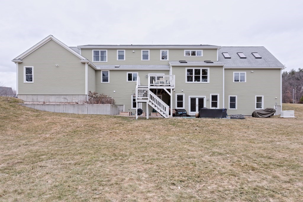 12 Cider Mill Road Stow, MA 01775 - Photo 40 of 42 a view of a house with large windows