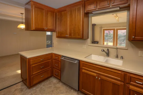 a kitchen with a sink and cabinets
