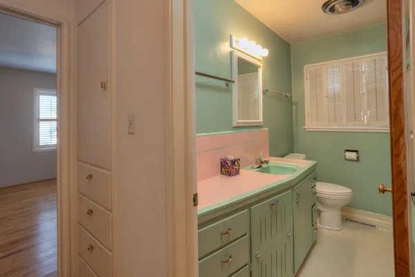 a bathroom with a sink and a mirror