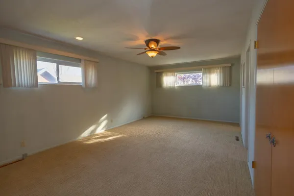 a view of empty room with windows