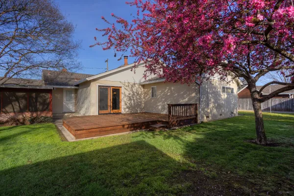 a view of a house with a yard porch and sitting area
