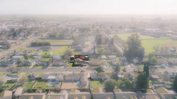 a view of a balcony with a yard