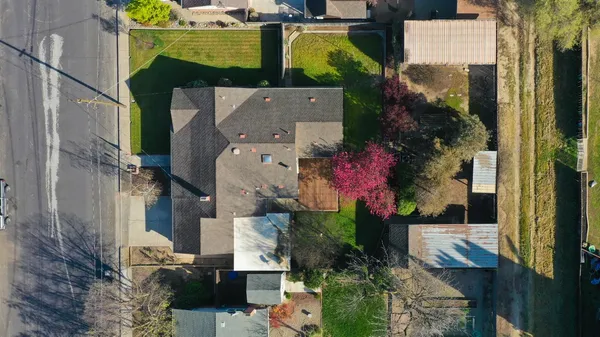 an aerial view of a houses with outdoor space