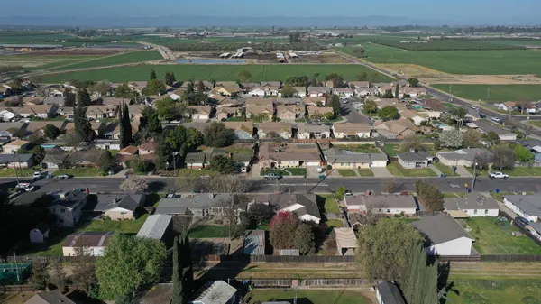 an aerial view of a city with a lake view