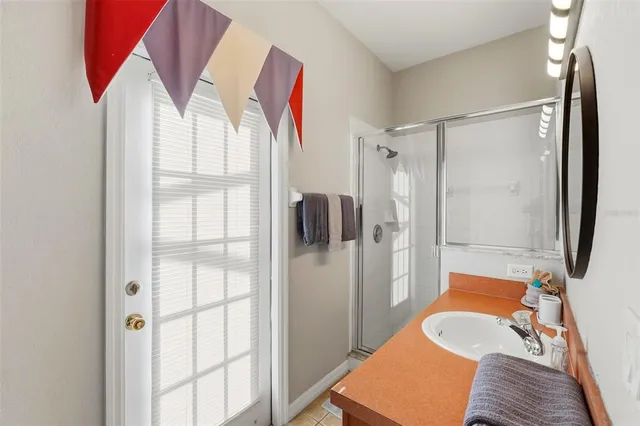 a bathroom with a tub and shower