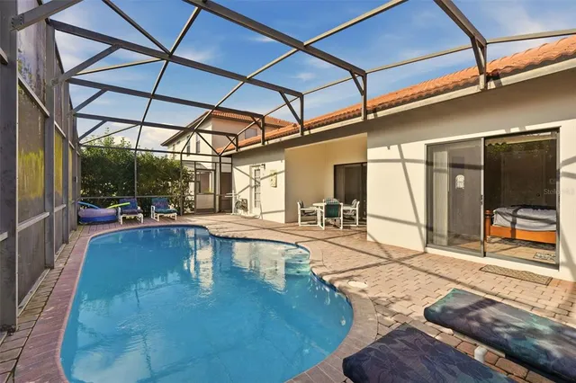 a view of a swimming pool with a patio