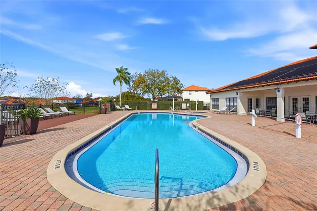 a view of a swimming pool with a lounge chairs