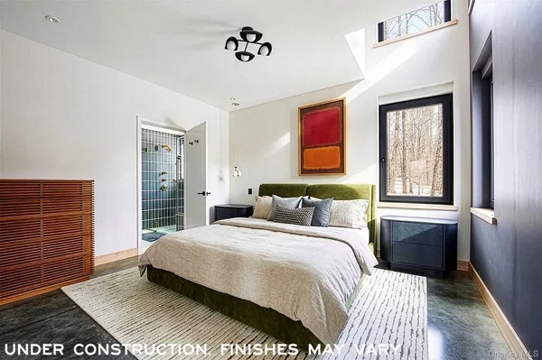 a bedroom with a bed and dresser