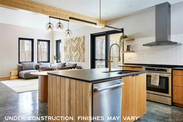 a kitchen with stainless steel appliances granite countertop a stove and a sink