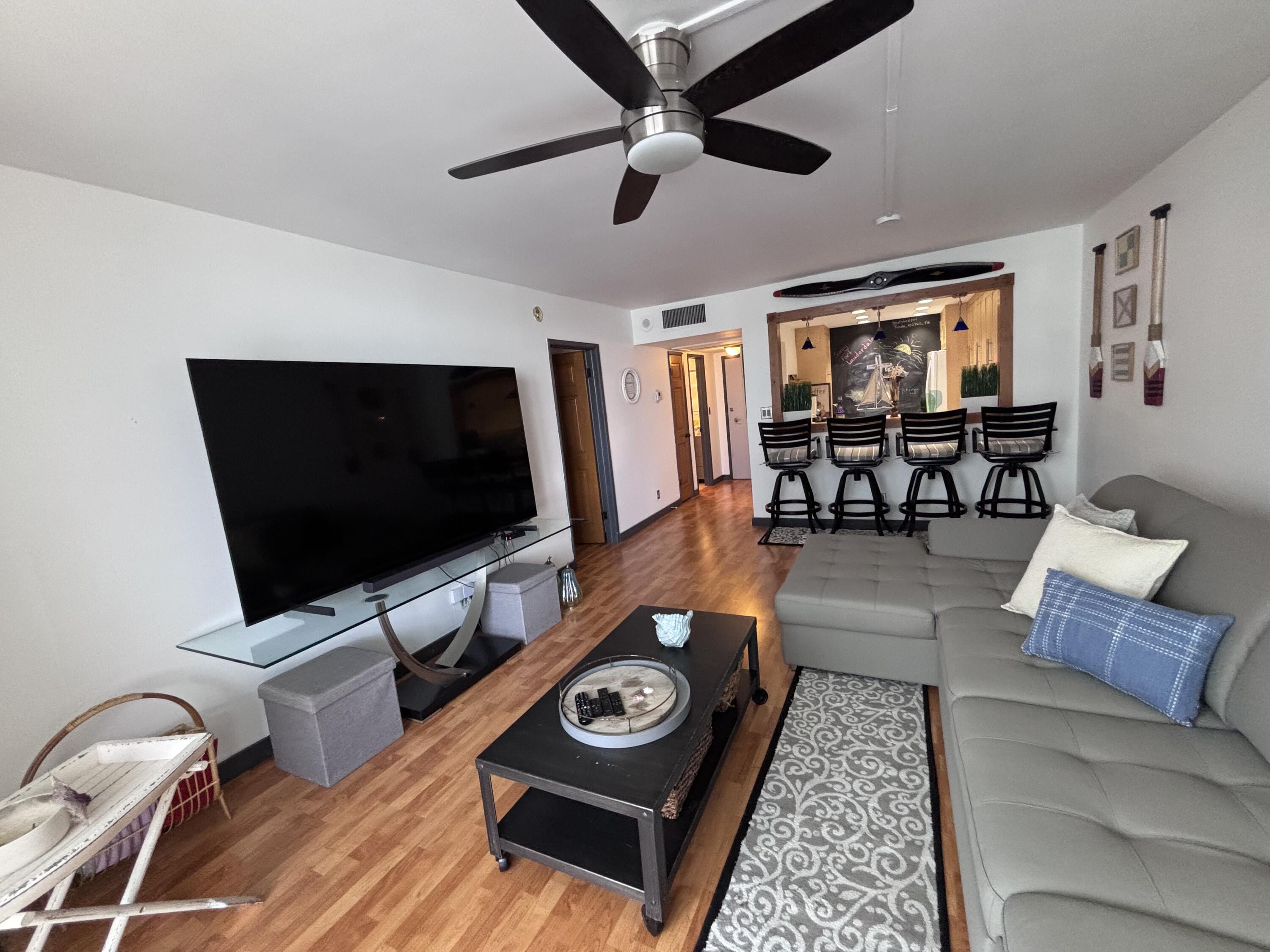 336 North Birch Road, Unit 8D Fort Lauderdale, FL 33304 - Photo 18 of 25 a living room with furniture and a flat screen tv