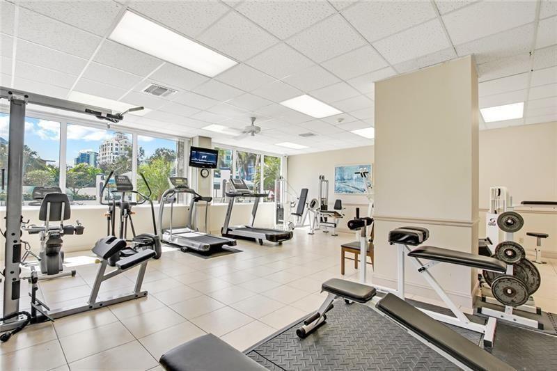 336 North Birch Road, Unit 8D Fort Lauderdale, FL 33304 - Photo 4 of 25 a view of a room with gym equipment