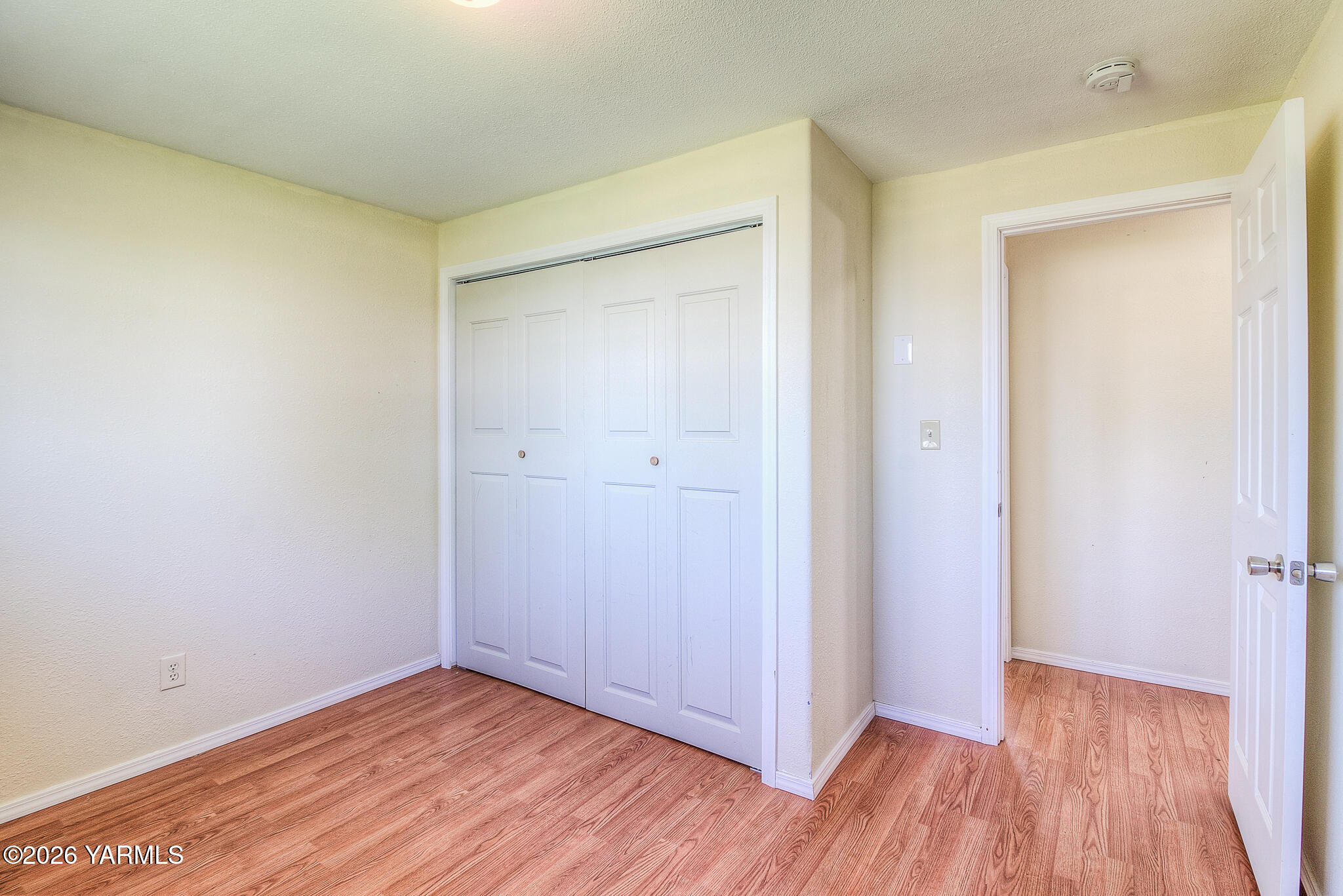 130 Green Giant Road Mabton, WA 98935 - Photo 17 of 34 a view of an empty room with wooden floor