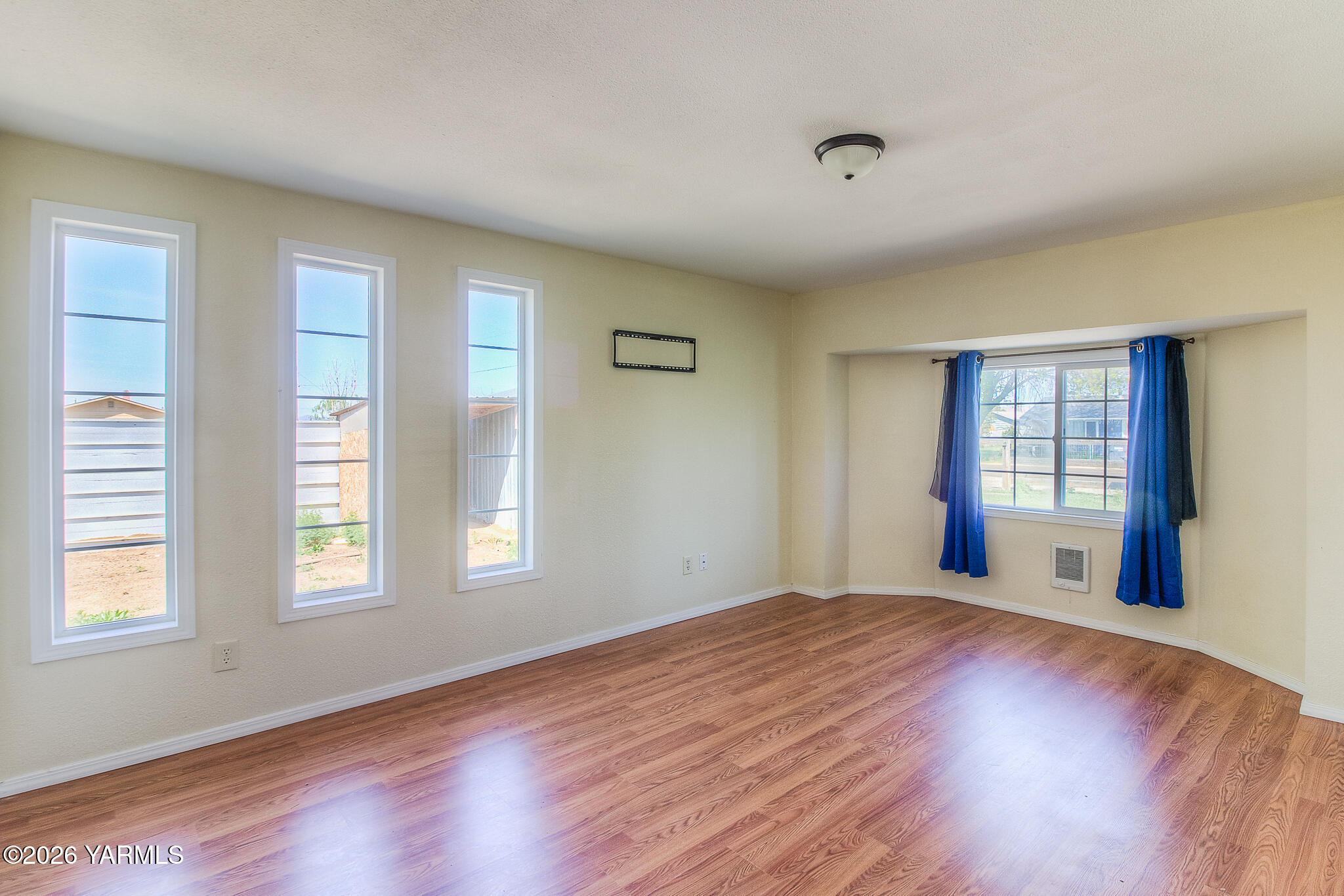 130 Green Giant Road Mabton, WA 98935 - Photo 20 of 34 a view of an empty room with wooden floor and a window