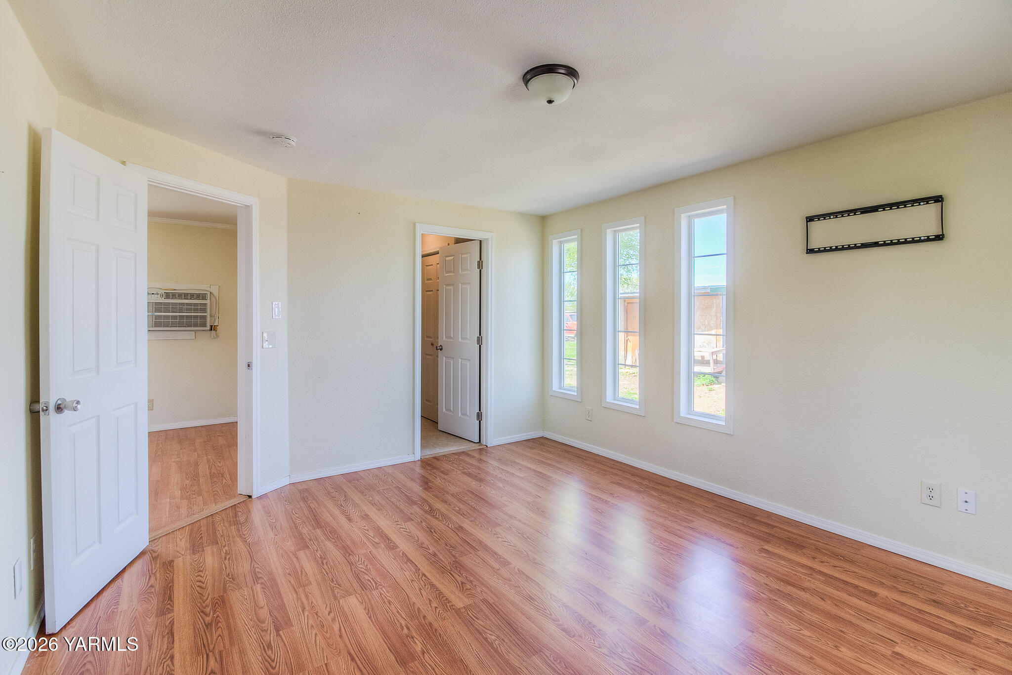 130 Green Giant Road Mabton, WA 98935 - Photo 21 of 34 a view of empty room with wooden floor and fan