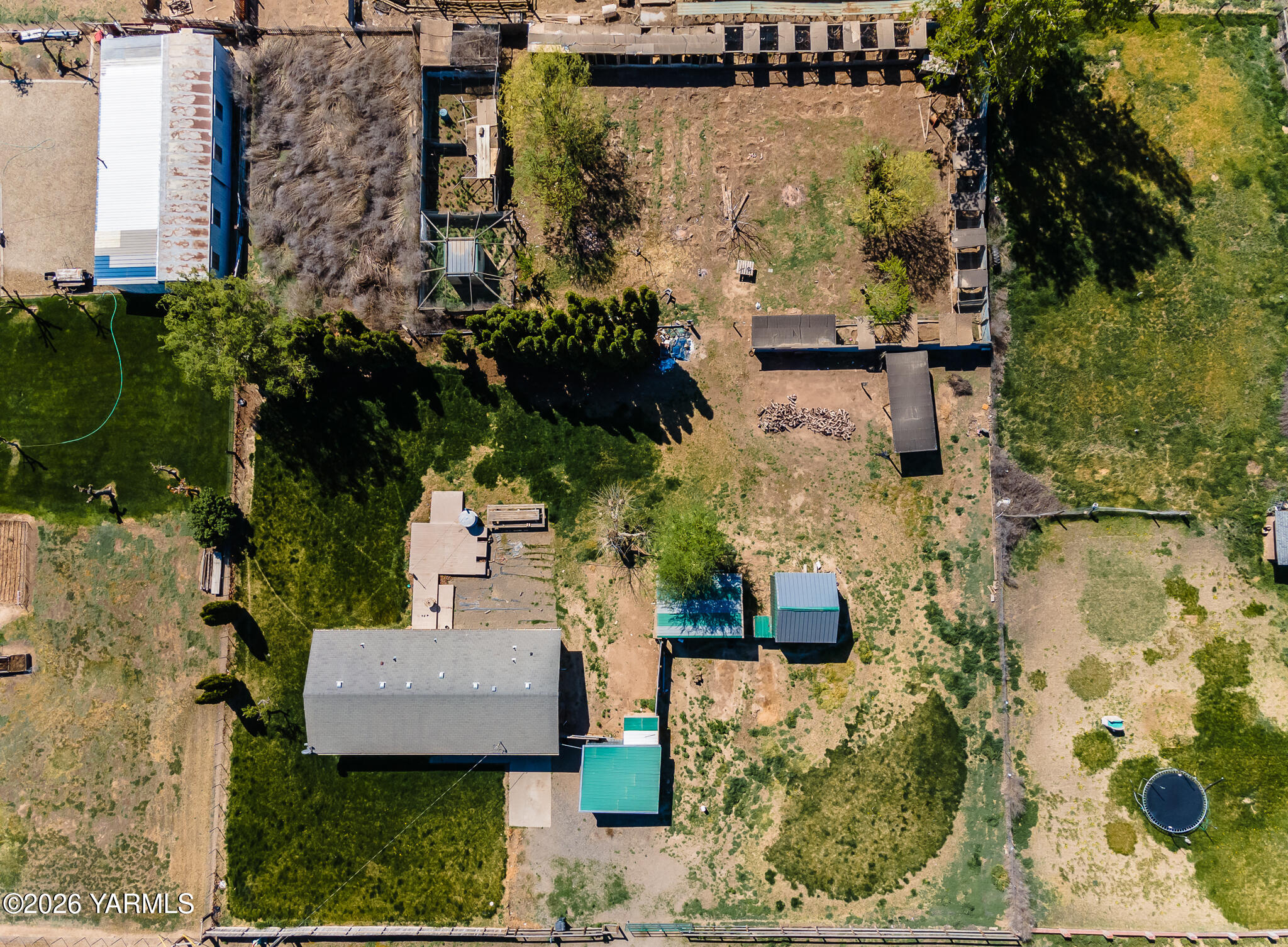 130 Green Giant Road Mabton, WA 98935 - Photo 33 of 34 aerial view of a house with a yard and large trees