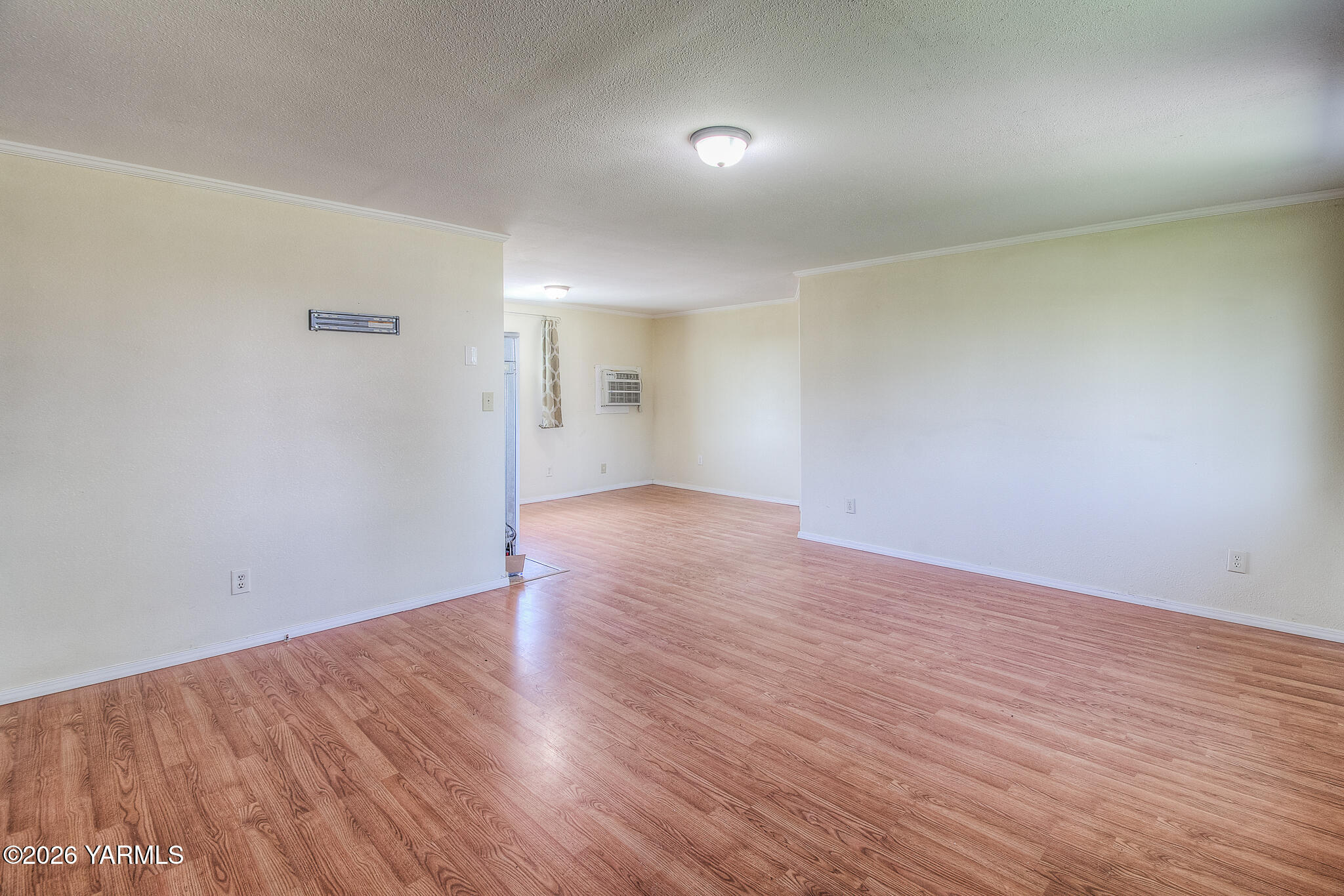 130 Green Giant Road Mabton, WA 98935 - Photo 7 of 34 a view of an empty room with wooden floor