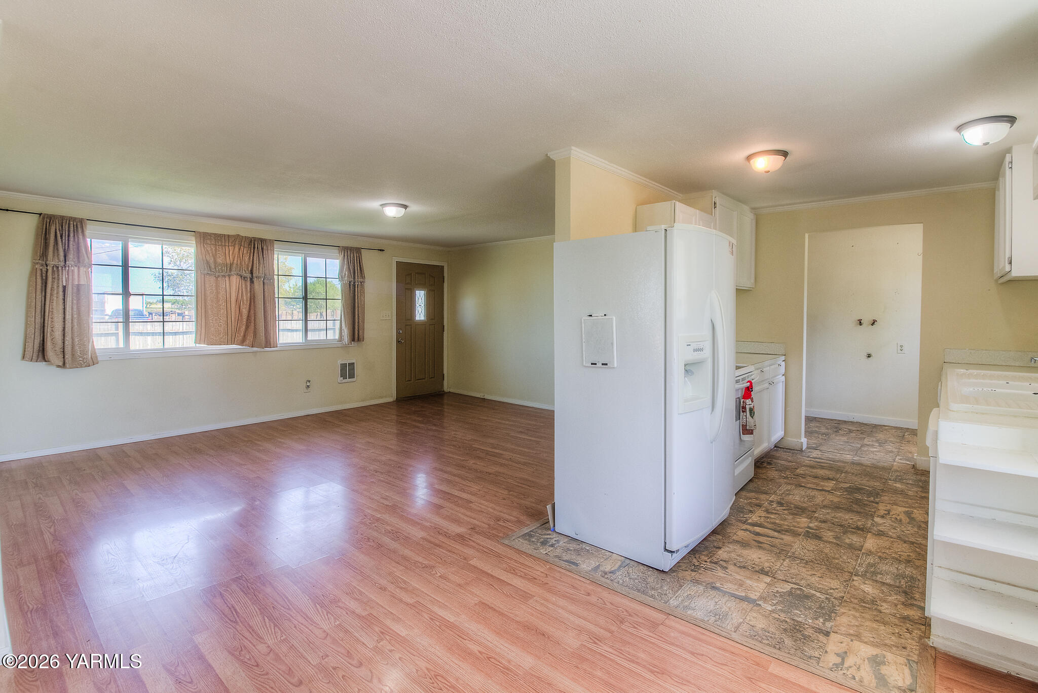 130 Green Giant Road Mabton, WA 98935 - Photo 10 of 34 a view of an empty room with wooden floor and a window