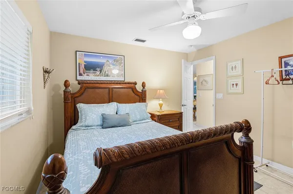 a bedroom with furniture and a window