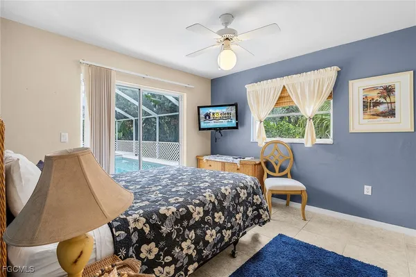 a bedroom with bed and a window