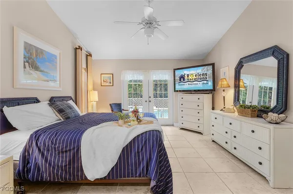a bed room with a bed mirror and a window