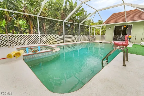 a view of a swimming pool with a porch