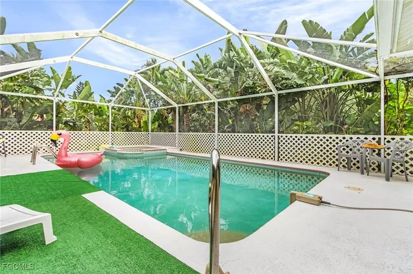 a view of a backyard with sitting area