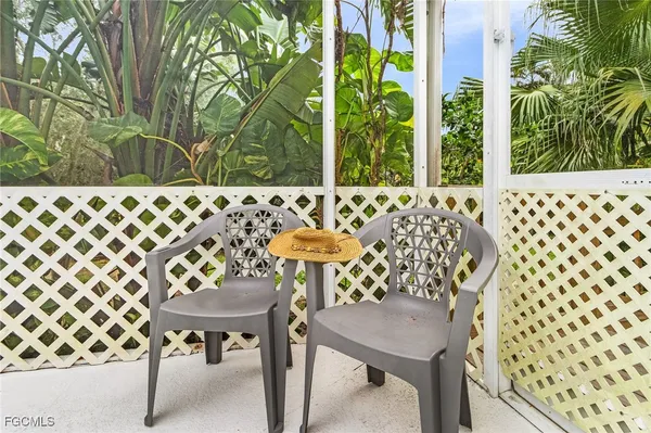 a view of a chairs and table in the patio