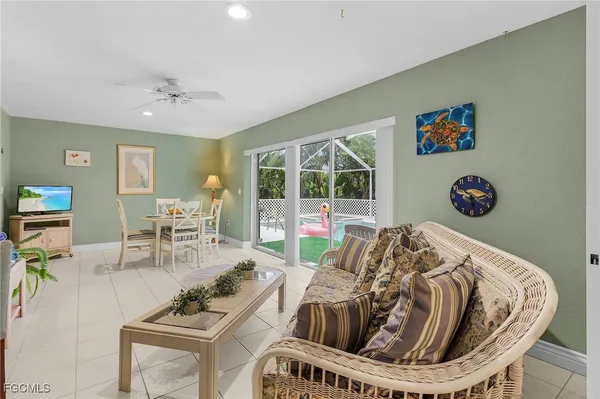 a spacious bedroom with a bed a couch and a window