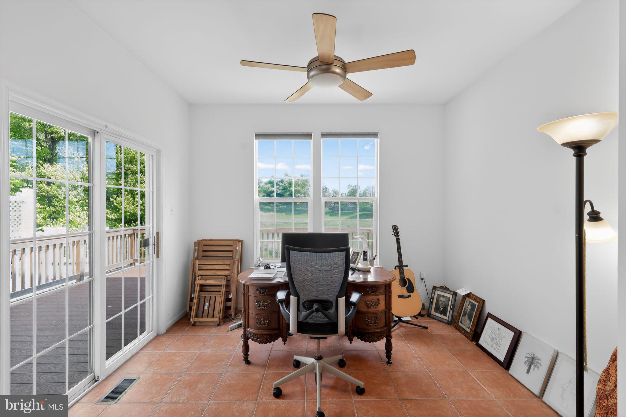 1034 Meandering Way Odenton, MD 21113 - Photo 15 of 30 a view of a workspace with furniture and a window